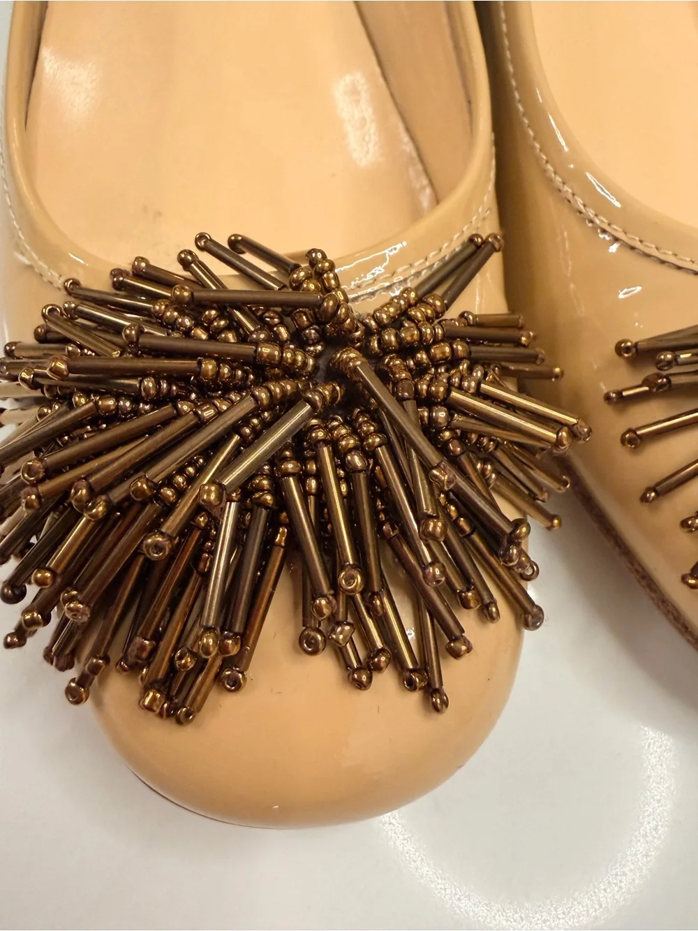 Sesto Meucci Nude Patent leather pumps  with Bronze Bead Pom-Poms